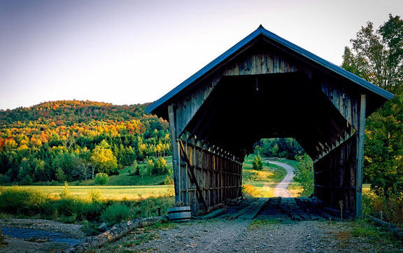 A covered bridge and fall foliage in Vermont